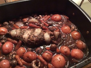 1.5 lb pork tenderloin 1 qt red potatoes 1 lb baby carrots 8 oz mushrooms 1 small, sweet onion (quartered) 1 tsp minced garlic 3.5 c beef broth 1.5 c red wine (I used Cabernet Sauvignon) .25 oz fresh, rosemary .25 oz fresh, thyme     *I normally sear the tenderloin before I roast it.  To do this, coat the tenderloin with olive oil, salt and pepper.  Heat a small amount of olive oil in a large frying pan and brown the outside of the tenderloin.* Preheat oven to 400 degrees. In a large baking dish, add the pork tenderloin and all vegetables.  Once all vegetables are added, pour beef broth and wine into dish.  Add minced garlic throughout mix.  Leave rosemary leaves and thyme leaves whole and separate and add equally to four corners of dish.   Bake at 400 degrees for 80 minutes or until pork equals 165 degrees. **The tenderloin I used is actually 1.7lbs.  It normally takes 35-40 minutes per pound when baking a pork tenderloin at 400 degrees.** 