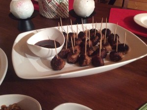 1/2 lb ground turkey 1 egg 1/4 c mozzarella cheese, shredded 1/4 c parmesan cheese, shredded 1/4 c plain, bread crumbs 1/3 c teriyaki sauce salt and pepper Preheat oven to 400 degrees.  In a large bowl, thoroughly mix all of the ingredients until they are blended.  My hands are small, so I don't have an issue making mini-meatballs.  However, if you do not have small hands, you can use a tablespoon to gauge the amount of mixture to make them "mini".  Place the meatballs on a non-stick cookie sheet or pan as you make them.  Once all meatballs are made, cook for about 20-25 minutes or until browned, flipping them once after 10 minutes. **I like my meatballs to have a "crusty" outside, so I fry them in a pan before I bake them.  Also, I use Kikkoman brand teriyaki in the mix, as well as, the sauce for dipping.**