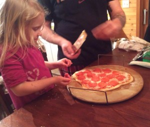 8 oz can crescent rolls 16 pepperoni slices 1/4 c Havarti cheese, shredded 3/4 c mozzarella cheese, shredded 3-5 tbsp Momma Mary's Gourmet Traditional Pizza Sauce 3 tbsp flour 1 pc parchment paper *rolling pin Preheat oven to 375 degrees.   Coat parchment paper and rolling pin with flour.  Combine all of the crescent rolls together in to a ball of dough.  Knead the dough with your hands on the parchment paper, slowly spreading it out into a small circle.  Using the rolling pin (or your hands), continue pressing down on the dough until you have a crust for the pizza.   Coat the crust with Momma Mary's Gourmet Traditional pizza sauce.  Top the pizza sauce with mozzarella cheese.  Add pepperoni slices to the top of the mozzarella cheese.  Once pizza is covered with pepperoni slices, add the Havarti cheese.  Bake for 15-20 minutes. **It took about 20 minutes or more for our pizza crust to brown.